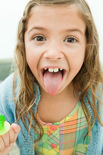 Candy Girl Sticking Out Tongue Pictures Images And Stock Photos Istock