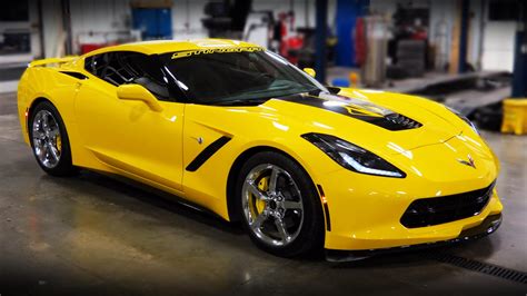 A Yellow Sports Car Parked In A Garage