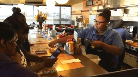 this waitress was being filmed by a customer and had no idea