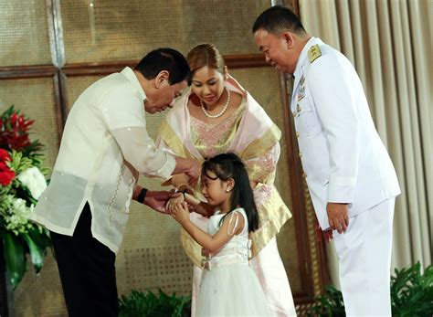 President Duterte Offers His Hand To A Daughter Of A Newly Appointed Armed Forces Of The