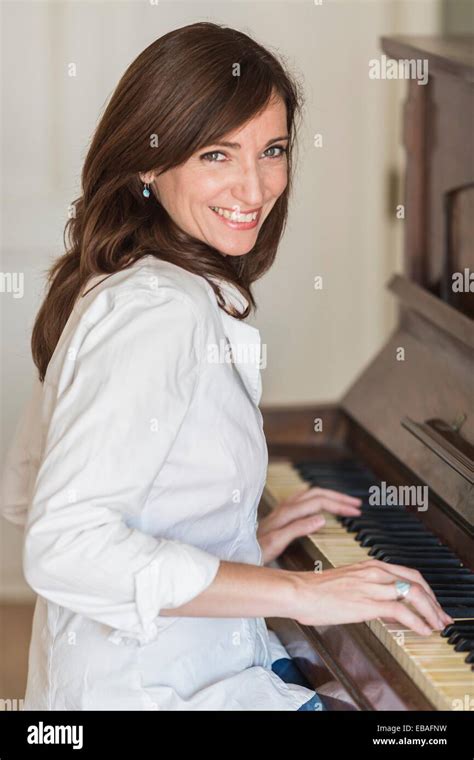 Woman Playing A Piano Stock Photo Alamy