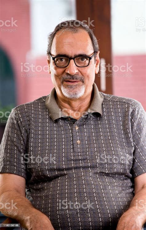 Old Man Sitting On Chair Stock Photo Download Image Now 60 64 Years
