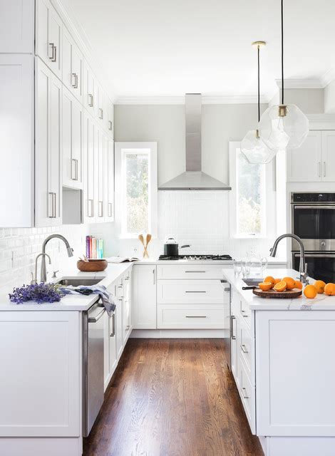 Microwave outlets are different from other outlets in the kitchen since they often attach to a cabinet and you string the wiring through the bottom of the cabinet. High ceiling with tall cabinets - Transitional - Kitchen - New York - by Think Chic Interiors ...