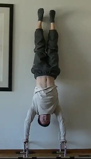 The Wall Handstand Push Up Tutorials And Progressions Roam Strong