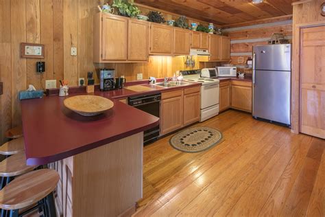 This authentic 1700's circa river front log cabin, complete with chinking, antique plank floors throughout, country porches, outside 7 person hot tub, is located just steps from the shenandoah. On The River | Log Cabin Rentals