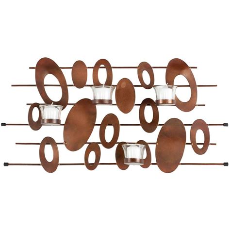 Iron metal work ivy and leaf scrolls serve as a feminine backdrop to this votive wall sconce. Safavieh Votive Burnt Copper Wall Decor Candle Sconce-WDC1015A - The Home Depot