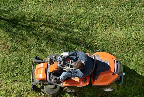 Man Mowing A Lawn On A Ride On Mower Stock Photo Image Of Motorized