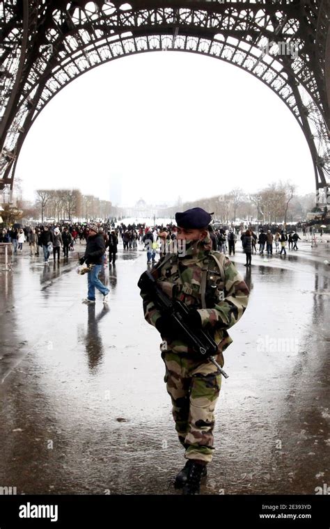 French Army Soldiers Patrol The Eiffel Tower In Paris France On