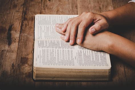Close Up Of Christian Woman Hand On Holy Bible Are Pray And Worship For