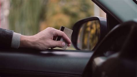 The short answer is yes but the longer answer is more complicated. Close-up view of man s hand holding a credit card sitting inside the car, waiting to pay. Stock ...