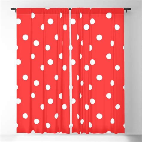 A Red Curtain With White Polka Dots On It