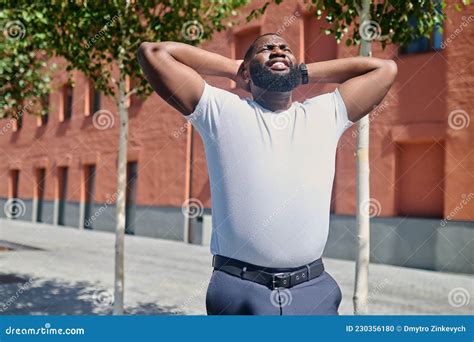A Dark Skinned Man Looking Relaxed After A Working Day Stock Photo