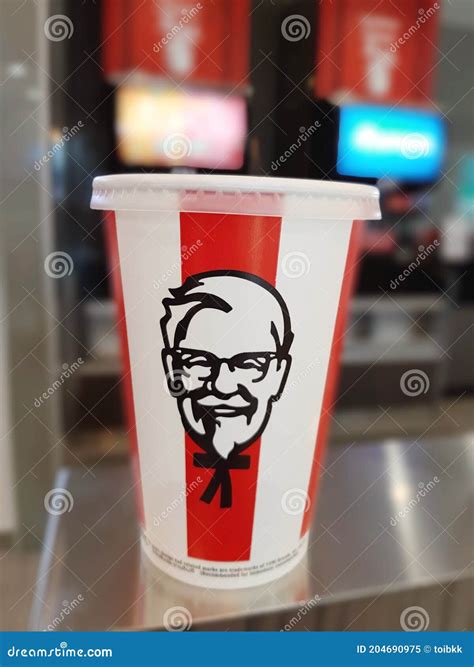 Defocused On Blur Disposable Soft Drink Pepsi Paper Cup With Lid At Kfc Editorial Image