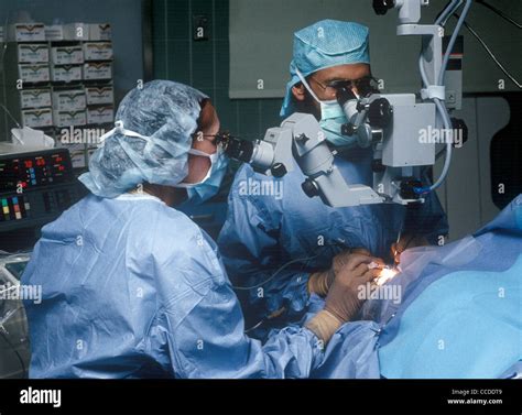 An Ophthalmologist Eye Doctor Surgeon Perform Surgery In The Or Stock