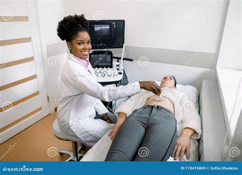 Sonographer Hand Examining Woman With Ultrasound Scanner Royalty Free