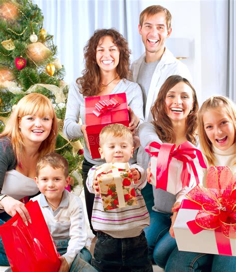 Games and puzzles that everyone in the family can enjoy. Big Family With Christmas Gifts Stock Image - Image of ...