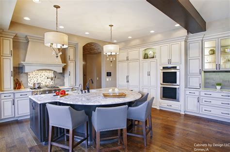 The kitchen island is made of a combination of solid wood legs and framing, as well as wood veneer to provide the bold structures all around. Traditional Kitchen | Curved kitchen island, Round kitchen ...
