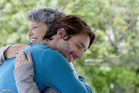 Loving Son Hugging His Mother Photo Getty Images