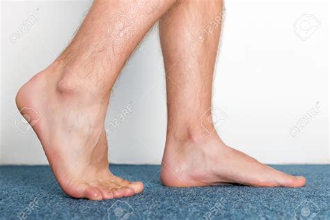 Healthy Male Feet Making A Step Over Home Like Background Pose