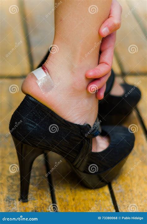 Foot Injured By Black High Heels Little Patch On Ankle Hands Taking