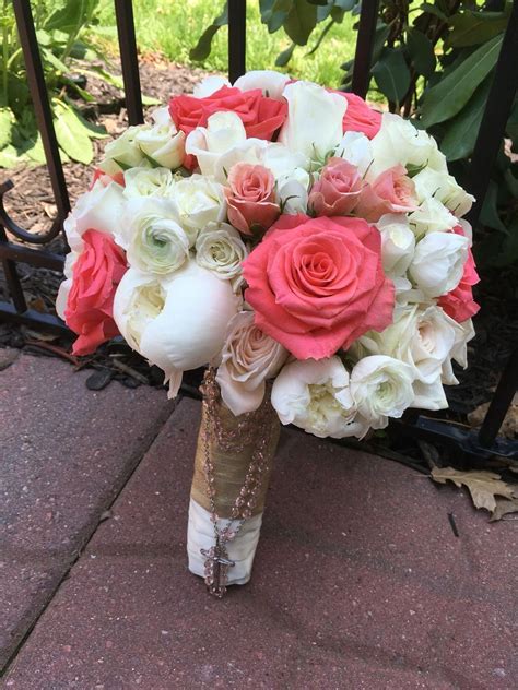 Coral Roses White Peonies And Ranunculus Make Up This Gorgeous Bouquet