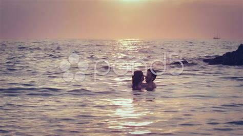 lovers kissing in the sea at sunset love man and woman kiss stock footage youtube