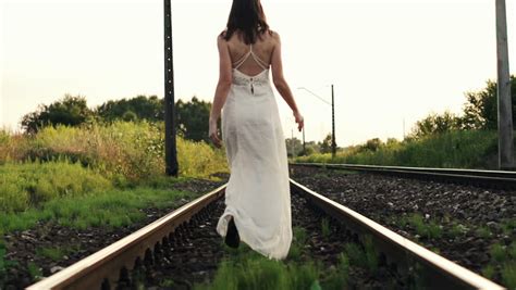 Woman Runing Away On Railroad Track Super Slow Motion 240fps Stock