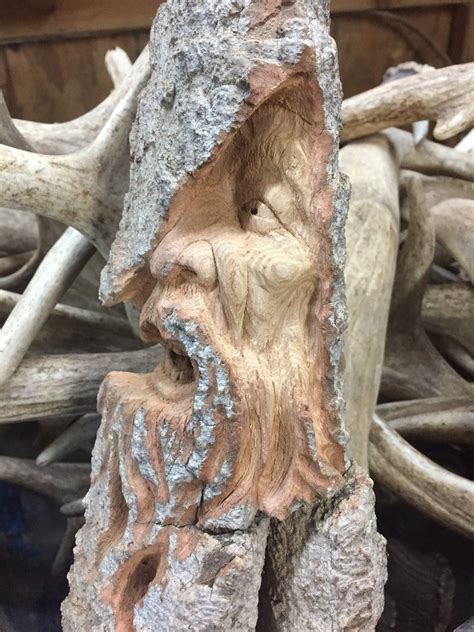 Wood Carving Of A Face Chainsaw Carving Artist Hand