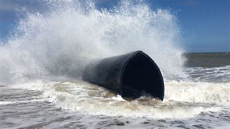 Giant Pipes Wash Up On Norfolk Beaches Bbc News