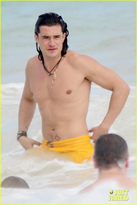 Orlando Bloom Shows Off His Soaking Wet Shirtless Body On The Beach With A Mystery Blonde