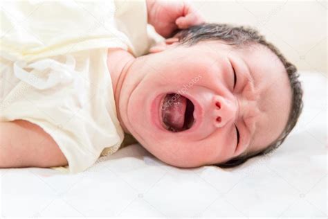 Newborn Baby Crying In Her Bed — Stock Photo © Vichie81 110725556