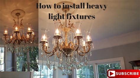 Tuck the wires into the ceiling box as much as possible and attach the light fixture to the box, using either the two screws or the long tube and nut that fits in. How to install a heavy light fixture - YouTube