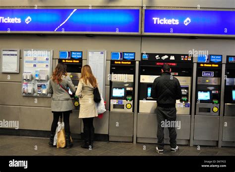 Commuters Buy Ticket At An Underground Station In London Uk Stock