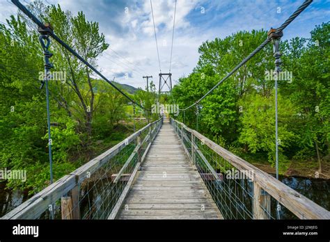 Swinging Pedestrian Bridge Over The James River In Buchanan Virginia