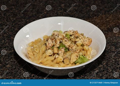Twisty Noodles With Chicken And Broccoli Bits Stock Photo Image Of