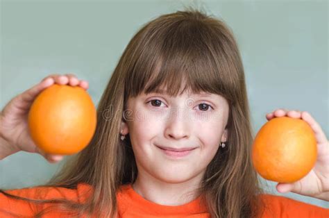 Girl Holds Orange Oranges And Smiling Stock Image Image Of Generous