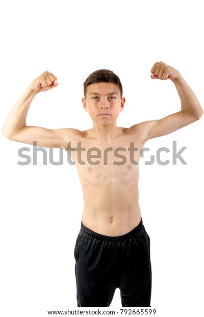 Shirtless Teenage Boy Flexing His Muscles Stock Foto 792665599