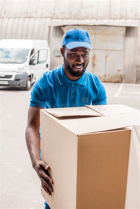 African American Delivery Man Carrying Big Stock Photo Image Of