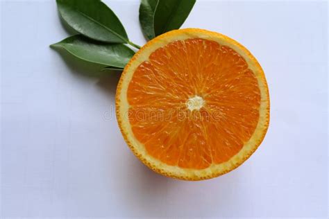 Orange Fruit Fruits Or Vegetables Half And Slice With Green Leaves