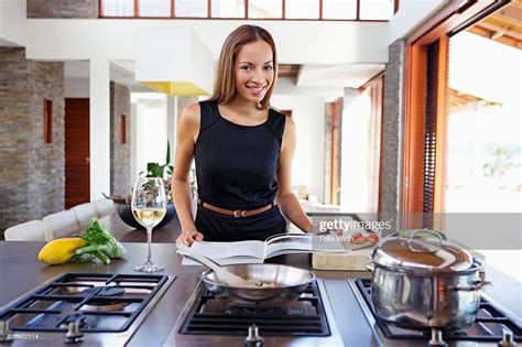 Portrait Of Young Woman Cooking Dinner High Res Stock Photo Getty Images