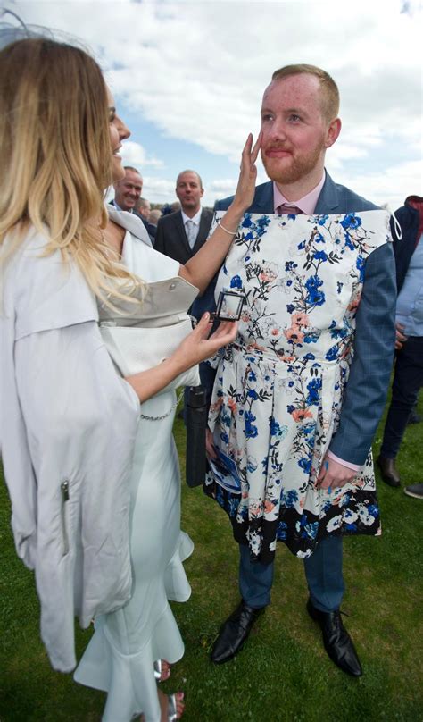 Plunging Dresses And Bare Legs On Display For Ladies Day At The Scottish Grand National The