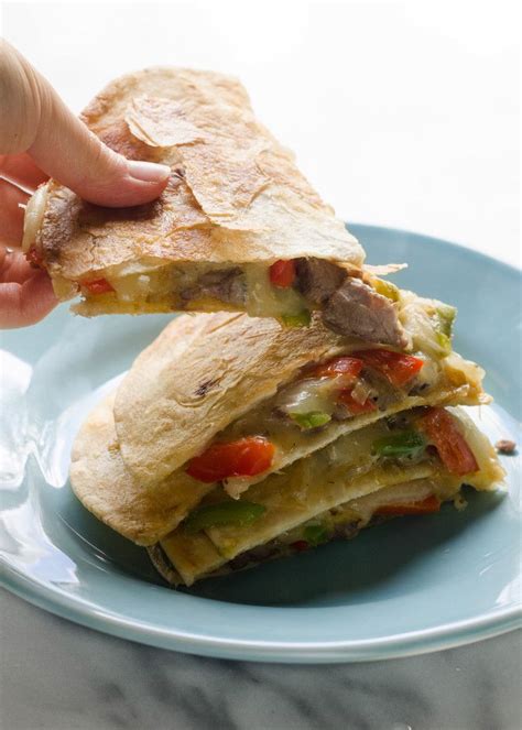 Lay 4 tortillas on a baking sheet and top each with beef mixture and cheddar . Cheesesteak Quesadillas | Recipe | Food
