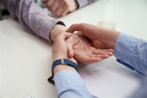 Wrist Palpation As A Part Of Hand Examination Stock Photo Download
