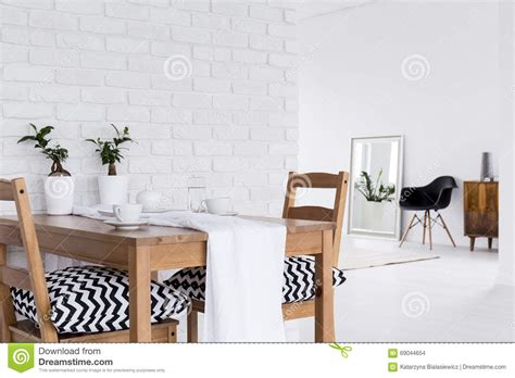 Multifunctional White Interior With Decorative Brick Wall Stock Photo