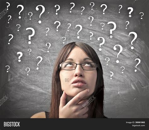 Woman With Doubtful Expression And Question Marks All Over Her Head