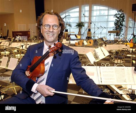 Dpa Dutch Star Violinist Andre Rieu Holds A Violin While Standing
