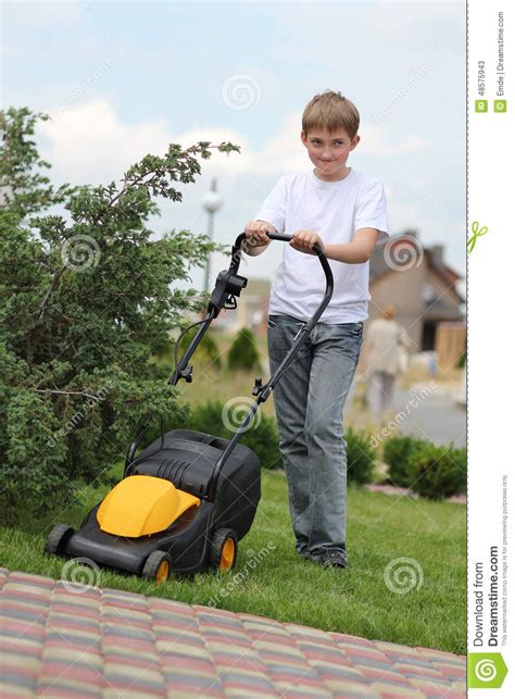Teen Son Helps Mother Clean Weeds In Garden Beds Royalty Free Stock