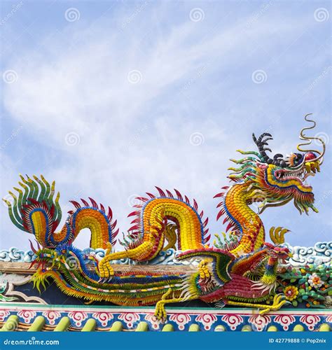 Chinese Dragon On Blue Sky With Cloud Top Stock Photo Image Of Golden