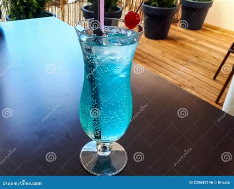 Glass Of Blue Alcoholic Drink Cocktail `sex In The Driveway` Vodka Peach Schnapps Curacao