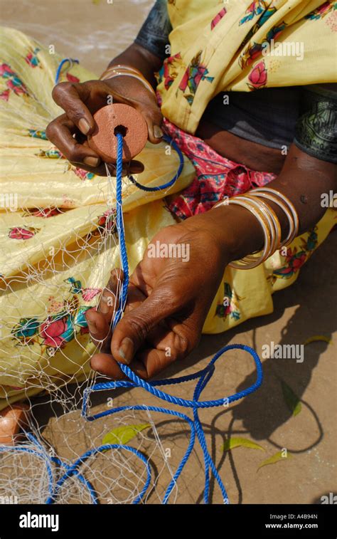 Stock Image Of Indian Tribal Village Woman S Hands Mending A Fishing